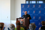 Speaker from the Jesuit Symposium speaking at the podium