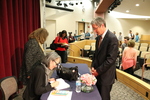 Ruth Ozeki signs a copy of the 2016 LMU Common Book for President Timothy Snyder